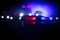 Police cars at night. Police car chasing a car at night with fog background. 911 Emergency response pSelective focus