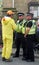 Police community support officers talk to a man in a costume at the annual easter monday charity duck race in hebden bridge