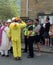Police community support officers talk to a man in a costume at the annual easter monday charity duck race in hebden bridge