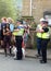 Police community support officers talk to people at the annual easter monday charity duck race in hebden bridge