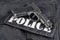 Police concept - handgun on black uniform