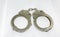 Police handcuffs and white background