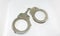 Police handcuffs and white background