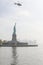 A police helicopter hangs over the Statue of Liberty in New York, United States