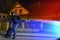 Police lights and runaway masked burglar with balaclava and blac