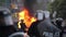 Police line with riot gear holds back crowd with car fire - HD 1080p