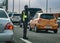 A police man with a face mask checks the traffic