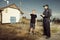 Police man questioning a teenage boy in fields