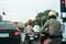 Police man riding on the motorcycle waiting for a traffic signal