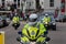 A police motorbike officer at the front of a motorcade escort