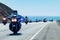 police motorcycle in a chase on a coastal highway