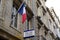 Police nationale signpost indicating station sign with french flag building in street