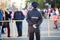 Police officer is on guard at the Victory Day celebration in the World War II. Rear view. Saint-Petersburg, Russia. Text is on