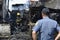 Police officer help maintain order during house fire that gutted interior shanty houses
