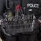 Police officer holding small wire basket