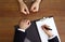 Police officer interrogating criminal in handcuffs at desk