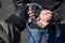 A police officer puts handcuffs on the hands of a bandit