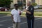 A police officer talks to an African American at a community events