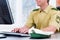 Police Officer working on desk in station