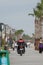 Police officers ride a motorcycle along a pedestrian road and keep order