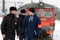 Police officers with a vigilante on a platform with a suburban electric train in Kaluga