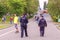 A police patrol protects the peace of citizens on the embankment of the Volga River on a summer day. The text in Russian: police