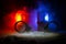 Police raid at night and you are under arrest concept. Silhouette of handcuffs with police car on backside. Image with the