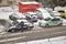 Police traffic partol stop a car. Policeman stand outside vehicle in bad weather and talk with driver while snow falls.