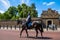 Police woman on horseback opposite St. James Palace. Selective focus