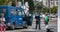 Policeman chatting with passers-by next to a Portuguese police truck