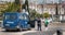 Policeman chatting with passers-by next to a Portuguese police truck