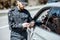 Policeman checking woman driver for alcohol intoxication