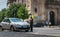 Policeman checks and writes a traffic ticket