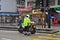 A policeman is doing his job on the street of Hong Kong