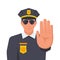 A policeman in the form makes the hand sign Stop.