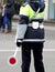 Policeman with the paddle while directing traffic