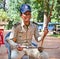 Policeman playing instrument Thro khmer, Cambodia.