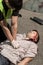 Policeman resuscitating victim