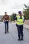 Policeman stops a boy on electric scooter