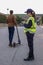 Policeman stops a boy on electric scooter