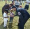 A policeman talks to little children