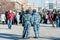 Policemen look at activists on picket to free Riot members