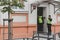 Policemen are standing in front of the building`s entrance door