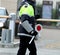 Policewoman with the paddle while directing traffic