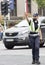 Policewoman standing in the intersection directing the traffic