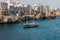 Polignano a mare breathtaking sight, Puglia, Italy. Italian panorama. Cliffs on adriatic sea and boat.