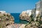 Polignano a mare coast in Bari, Italy during summer with turquoise blue water in the sea