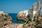 Polignano a mare coast in Bari, Italy during summer with turquoise blue water in the sea