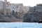 Polignano a Mare coast, southern Italy, city on the seashore, simple white buildings in southern Italy, beach between the rocks