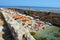 POLIGNANO A MARE, ITALY - AUGUST 4, 2017: small beach with umbrellas crowded, Apulia, Italy